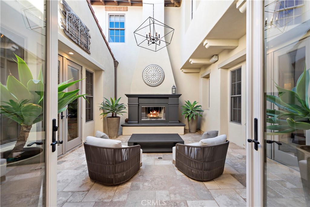 27 Pisano Street Ladera Ranch, CA 92694 - Photo 6 of 71 a living room with furniture and a fireplace