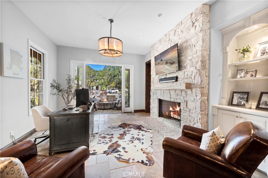 27 Pisano Street Ladera Ranch, CA 92694 - Photo 8 of 71 a living room with furniture fireplace and flat screen tv