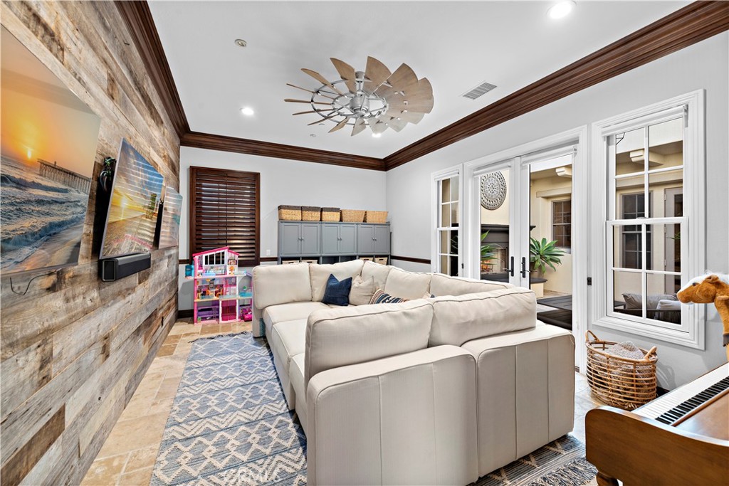 27 Pisano Street Ladera Ranch, CA 92694 - Photo 10 of 71 a living room with furniture and a flat screen tv