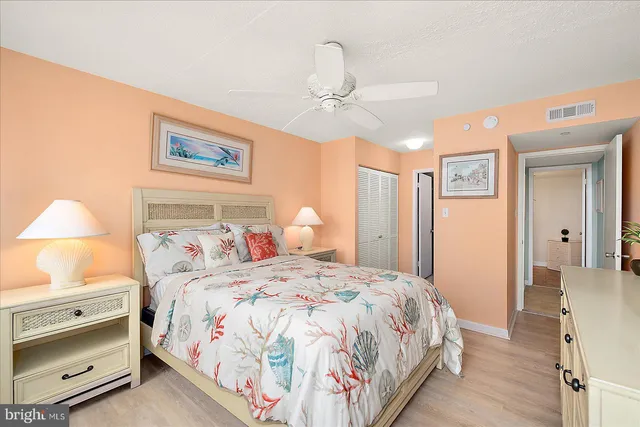 a bedroom with a bed and a lamp