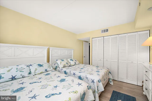 a bedroom with a bed and a closet