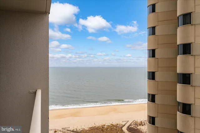 a view of a balcony with a table and chairs