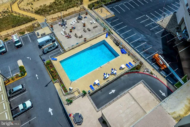 a view of a balcony with wooden walls and outdoor seating