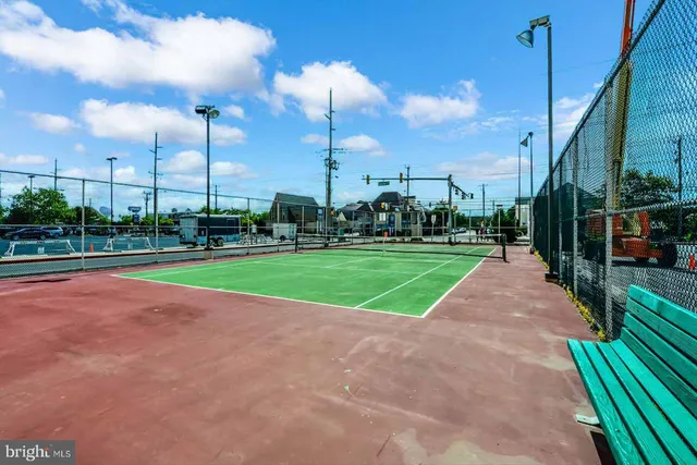 a living room with furniture a rug and a large window