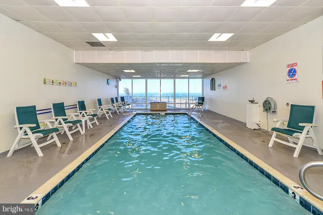 a view of a chairs and table in a room