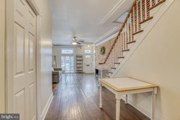 a view of entryway with wooden floor
