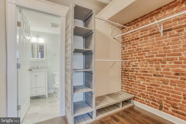 a bathroom with a shower and a glass door