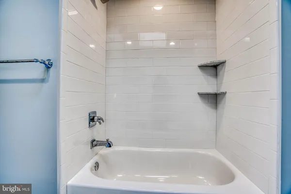 a close up of a bathtub in a bathroom