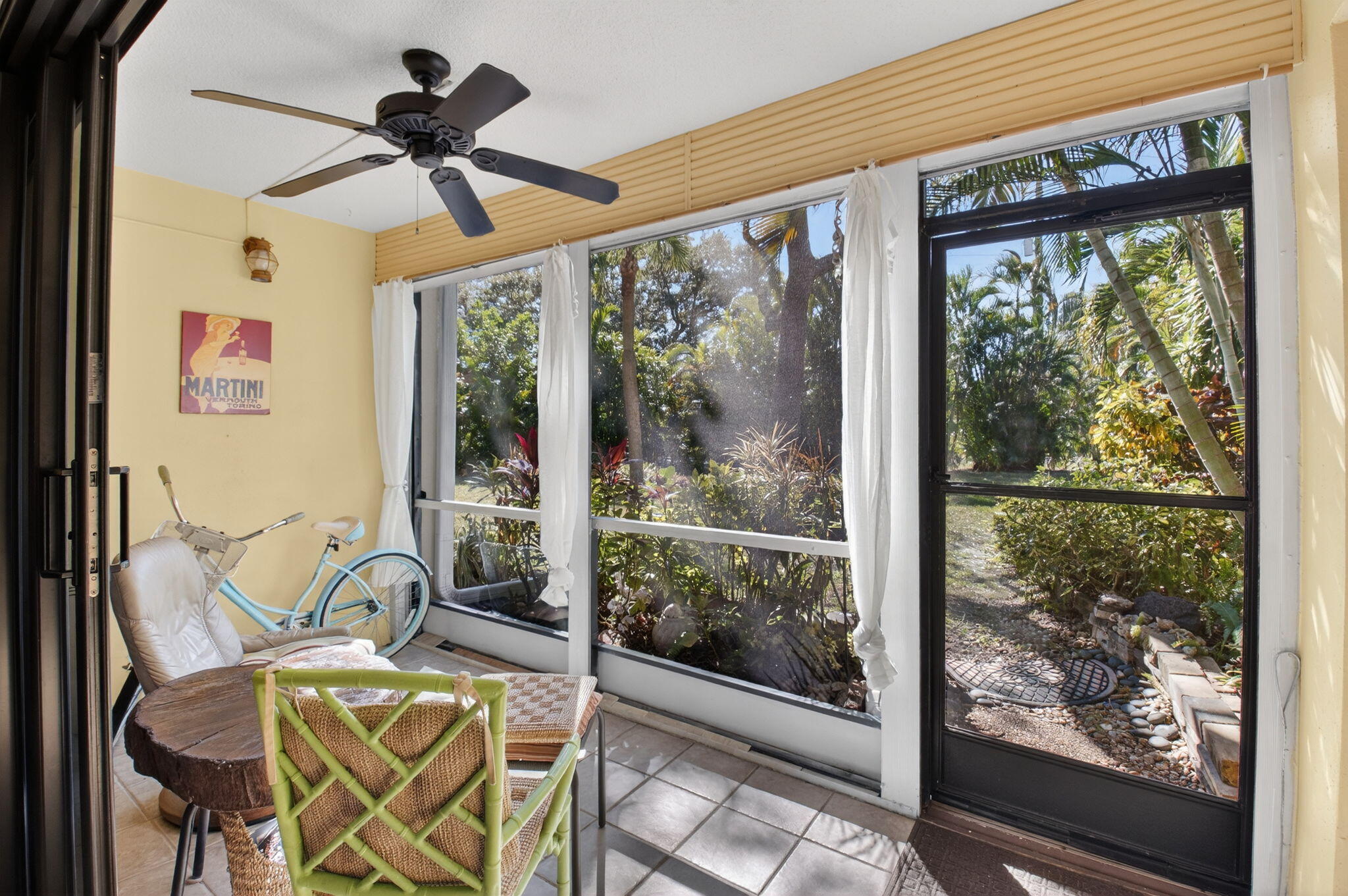 501 Dotterel Road, Unit 26B Delray Beach, FL 33444 - Photo 17 of 48 a view of a livingroom with furniture wooden floor ceiling fan and window