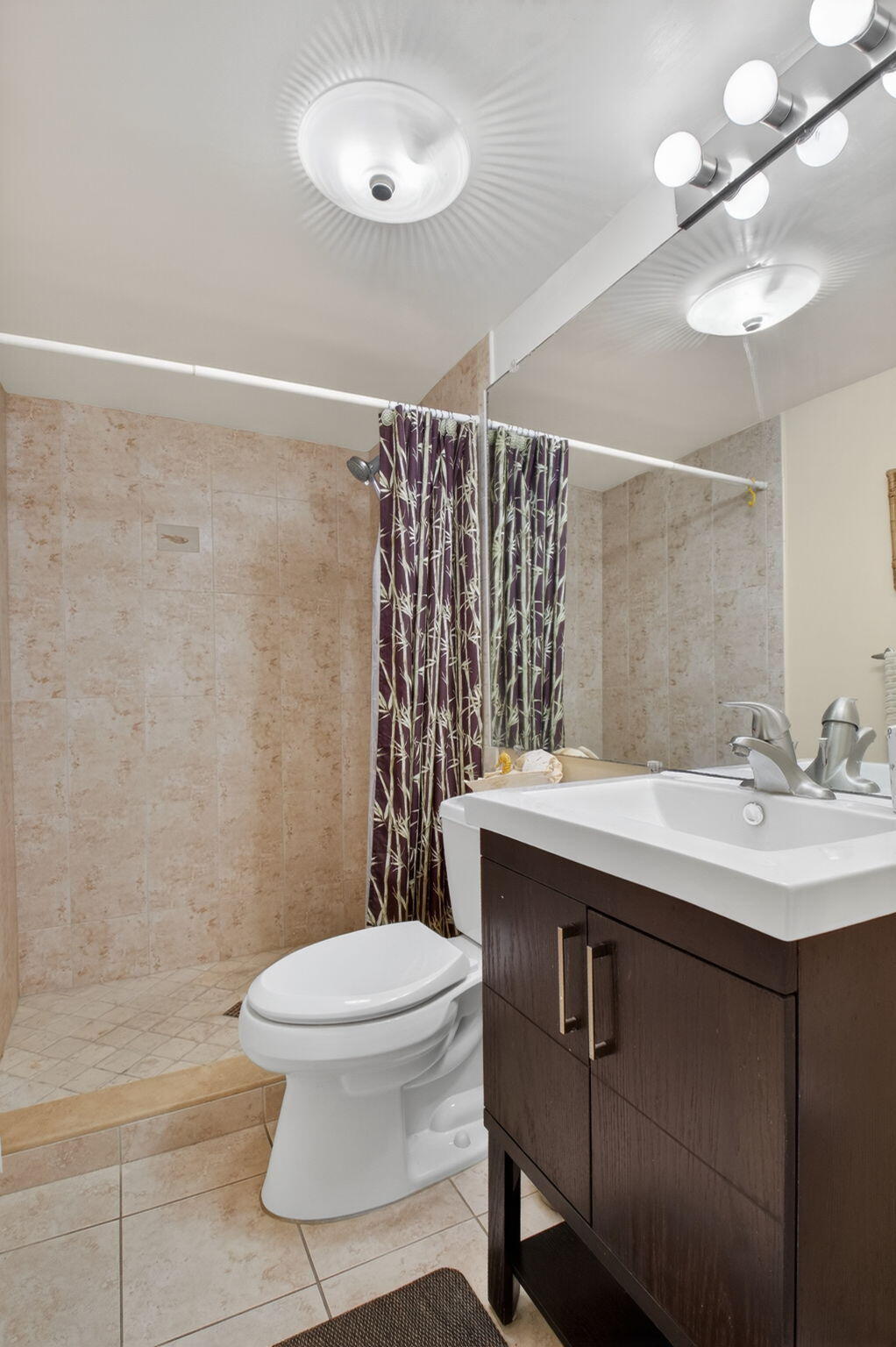 501 Dotterel Road, Unit 26B Delray Beach, FL 33444 - Photo 26 of 48 a bathroom with a sink toilet and shower