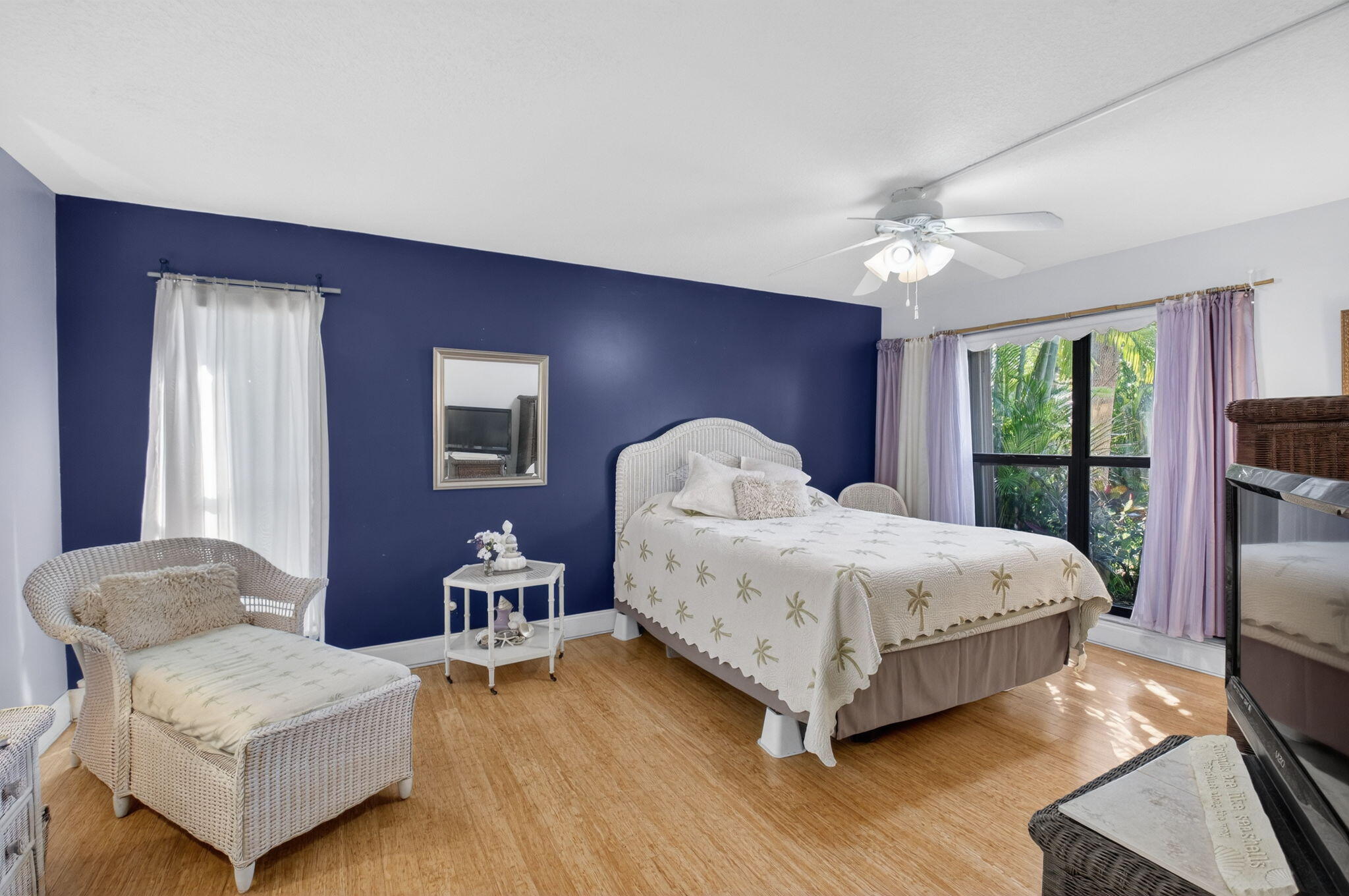 501 Dotterel Road, Unit 26B Delray Beach, FL 33444 - Photo 28 of 48 a bedroom with a bed wooden floor and window