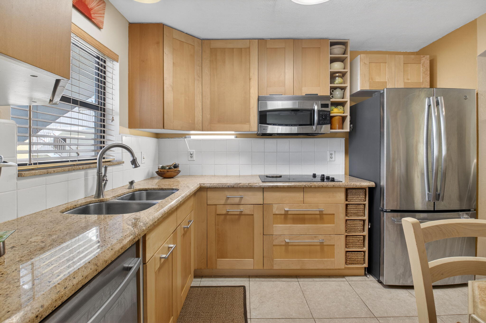 501 Dotterel Road, Unit 26B Delray Beach, FL 33444 - Photo 6 of 48 a kitchen with a sink stove and refrigerator