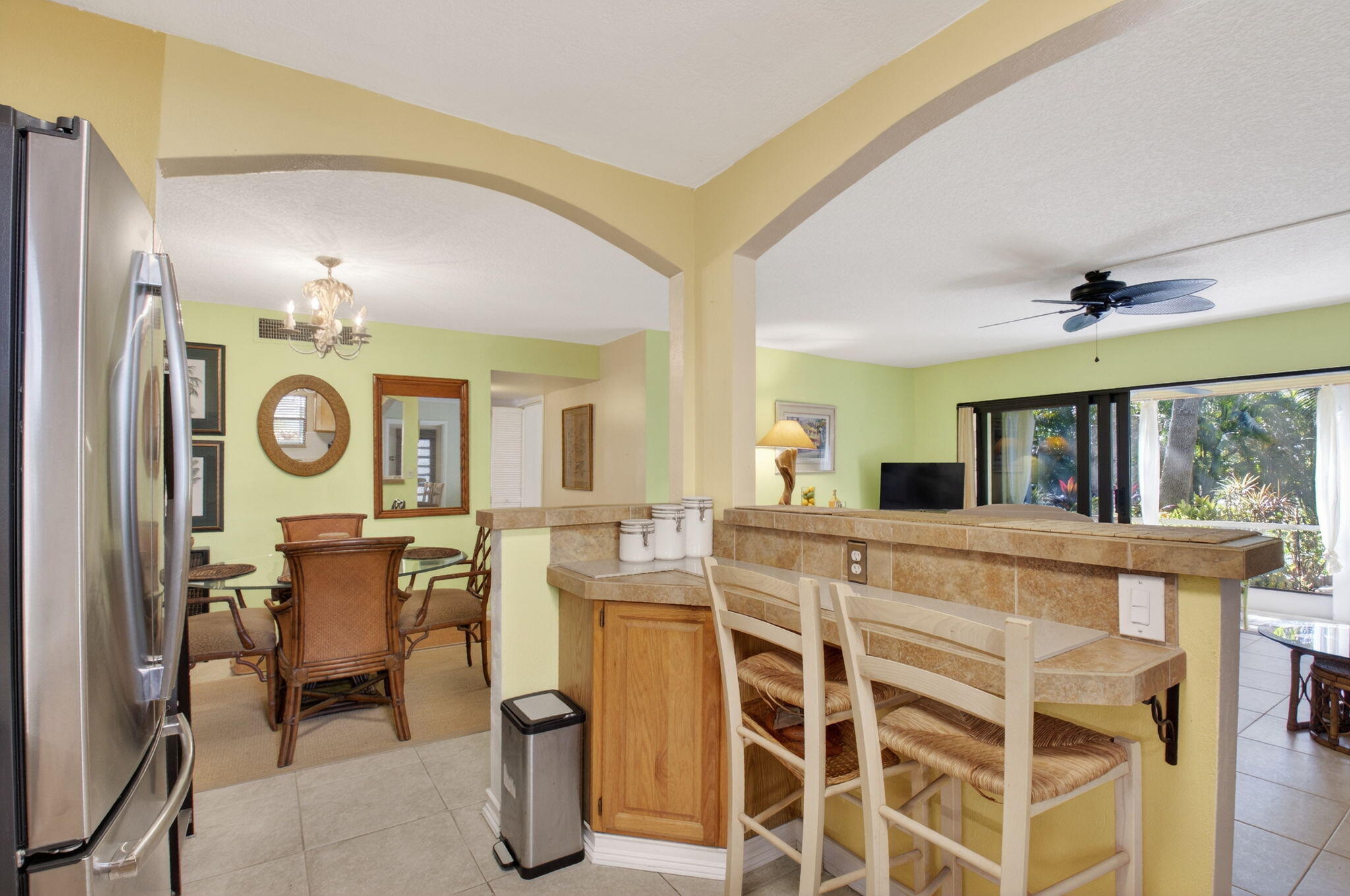 501 Dotterel Road, Unit 26B Delray Beach, FL 33444 - Photo 7 of 48 a view of a dining room with furniture and chandelier