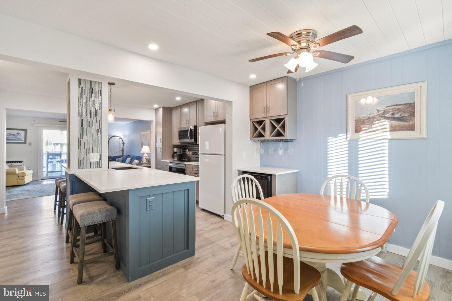 722 Mooring Road, Unit A104 Ocean City, MD 21842 - Photo 3 of 33 a dining room with furniture and window