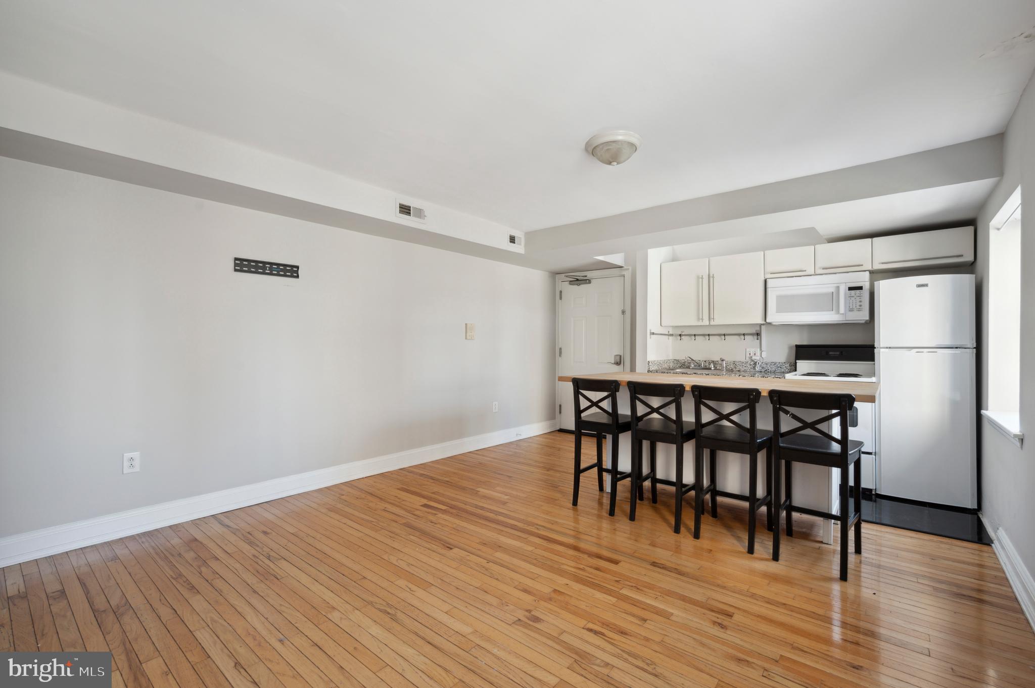 1723 Spruce Street Philadelphia, PA 19103 - Photo 19 of 24 a view of a dining room with furniture and wooden floor