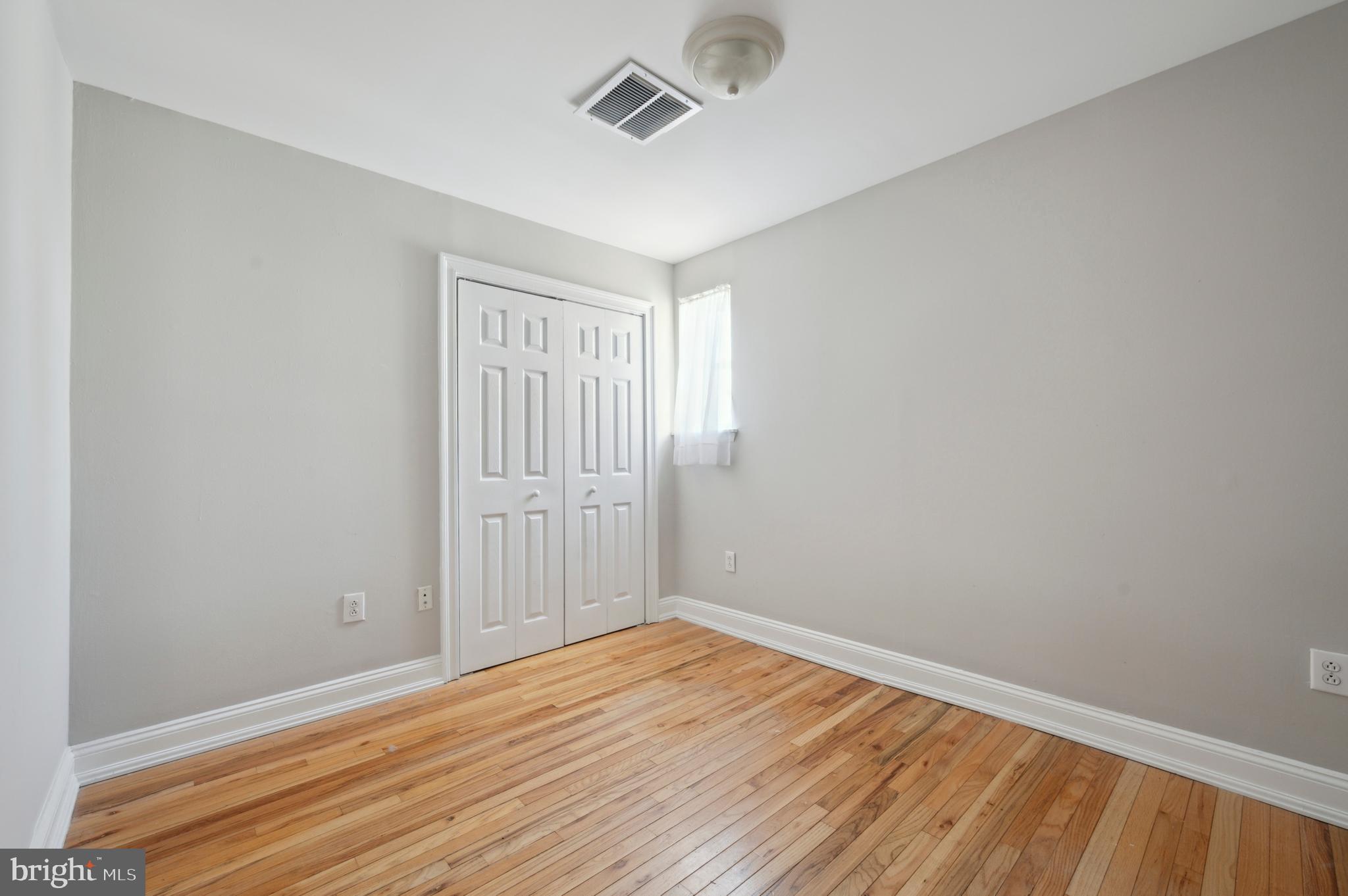 1723 Spruce Street Philadelphia, PA 19103 - Photo 21 of 24 wooden floor in an empty room