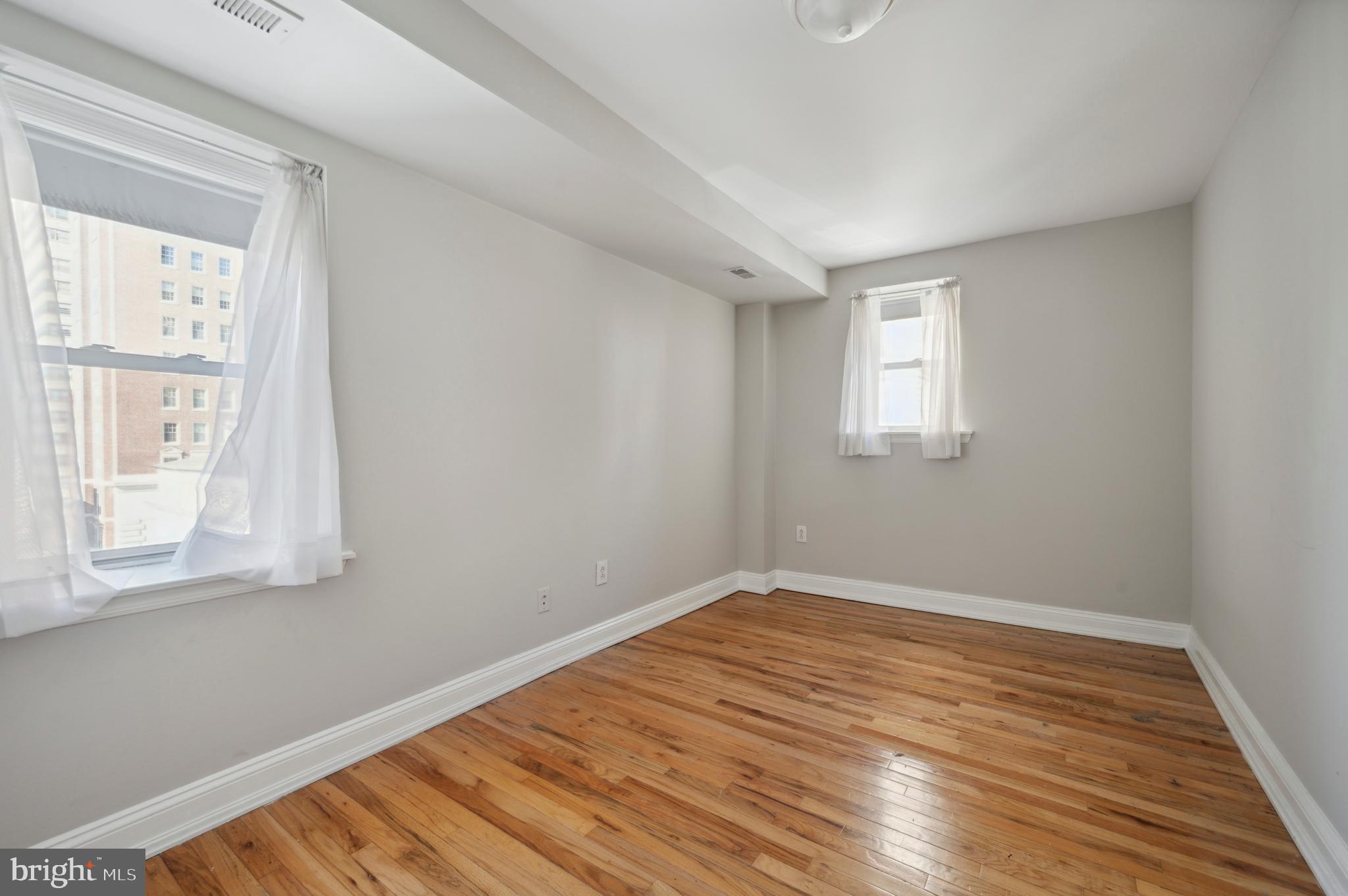 1723 Spruce Street Philadelphia, PA 19103 - Photo 23 of 24 a view of empty room with wooden floor and fan