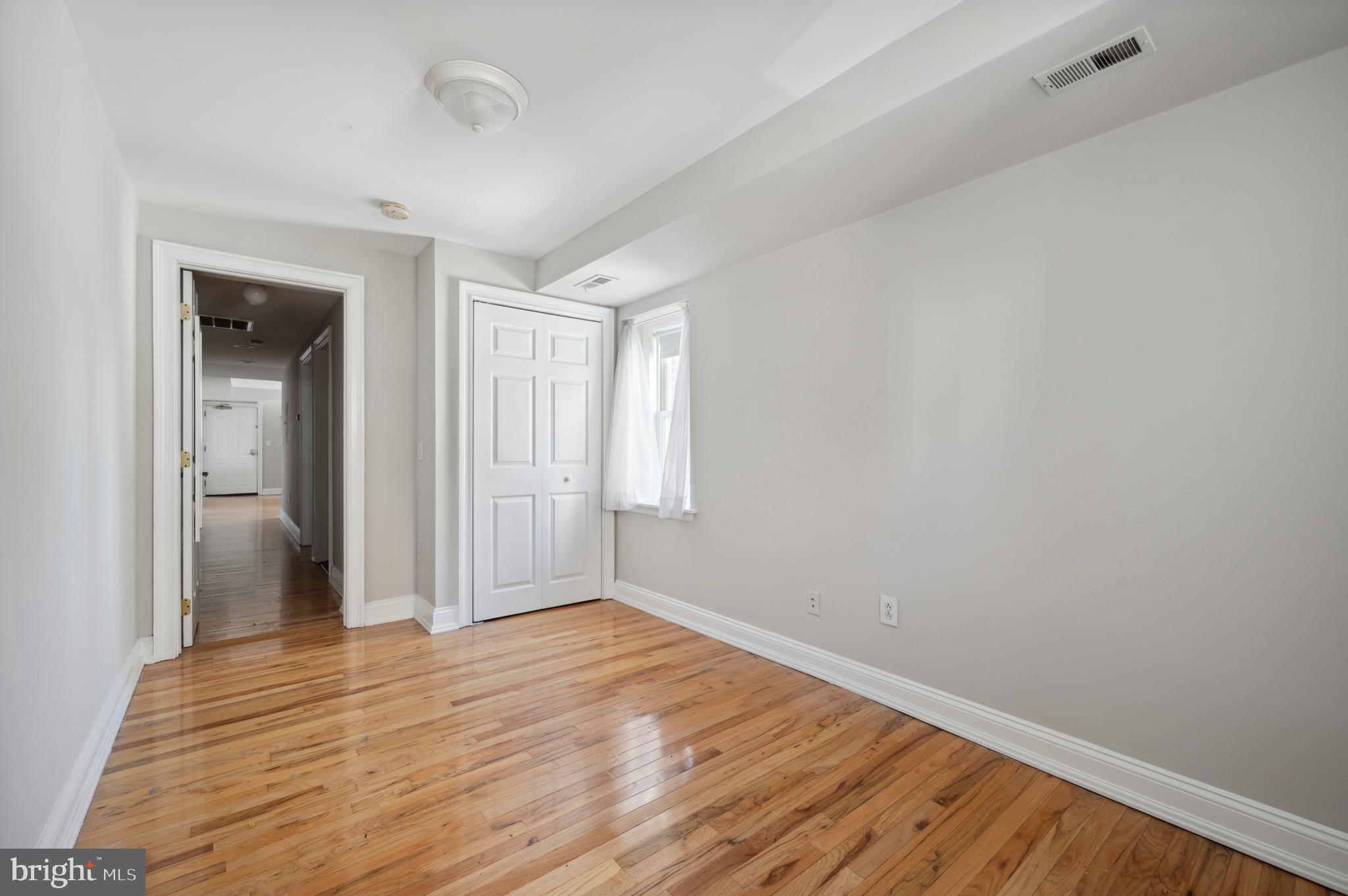 1723 Spruce Street Philadelphia, PA 19103 - Photo 24 of 24 a view of wooden floor and windows in a room