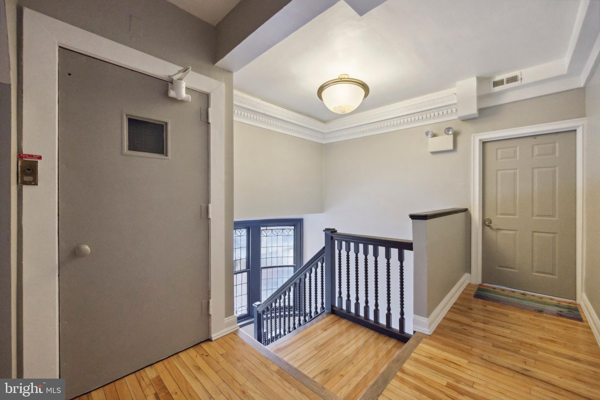 1723 Spruce Street Philadelphia, PA 19103 - Photo 9 of 24 a view of a room with wooden floor and stairs