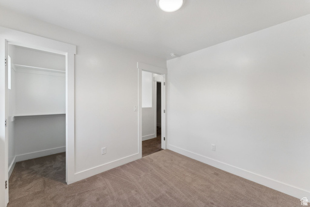 1619 North Angel Street West Layton, UT 84041 - Photo 11 of 32 Unfurnished bedroom with carpet and a walk in closet