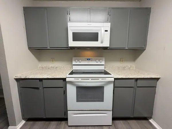 a kitchen with a sink and a refrigerator