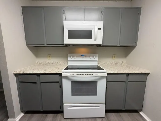 a kitchen with a sink and a refrigerator