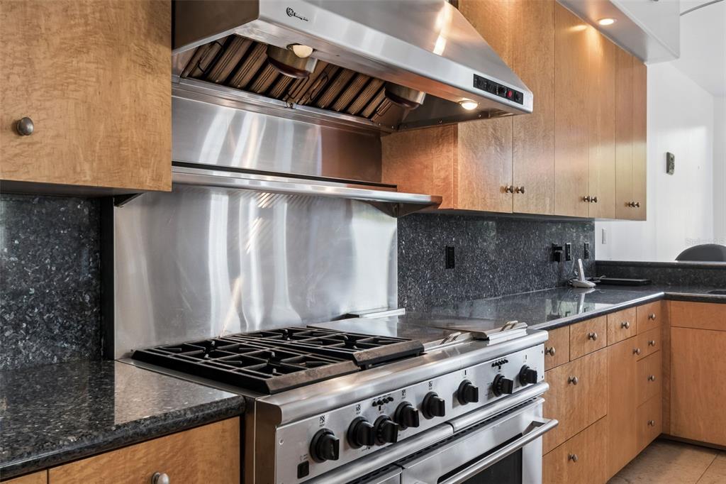 2811 Sunset Way St. Pete Beach, FL 33706 - Photo 28 of 97 a stove top oven sitting inside of a kitchen