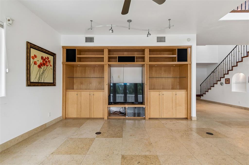 2811 Sunset Way St. Pete Beach, FL 33706 - Photo 31 of 97 a view of a hallway with a cabinet and mirrors