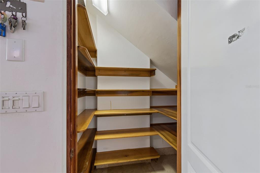 2811 Sunset Way St. Pete Beach, FL 33706 - Photo 34 of 97 a view of staircase with white walls and a window
