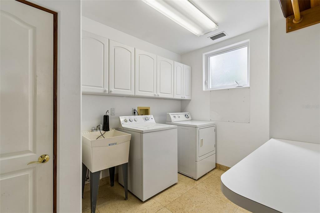 2811 Sunset Way St. Pete Beach, FL 33706 - Photo 35 of 97 a utility room with dryer and washer