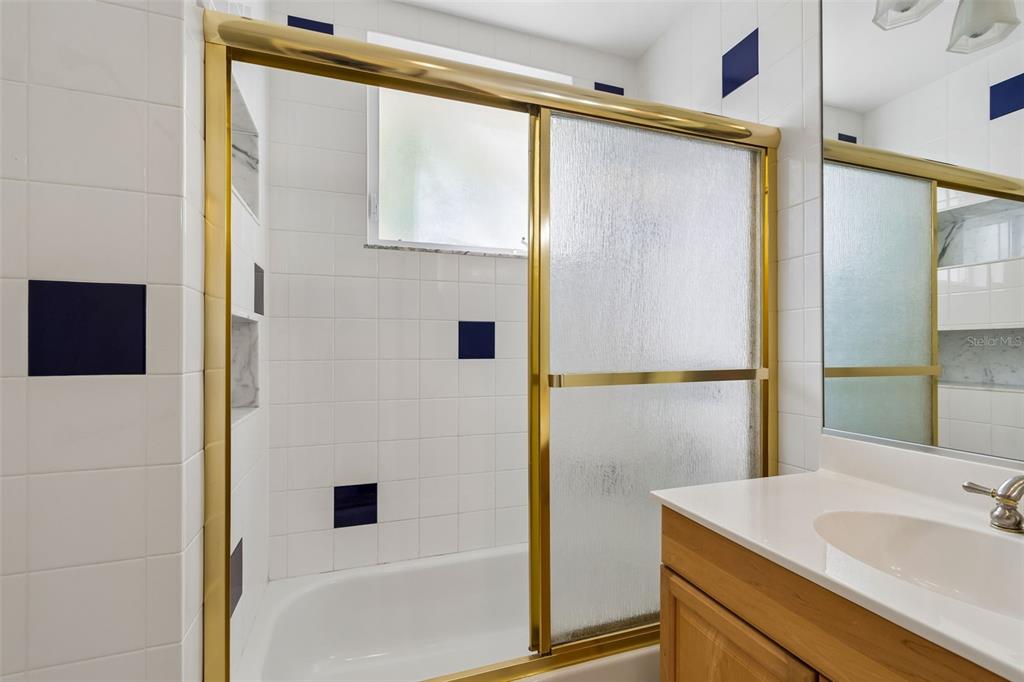 2811 Sunset Way St. Pete Beach, FL 33706 - Photo 40 of 97 a bathroom with a sink and a mirror