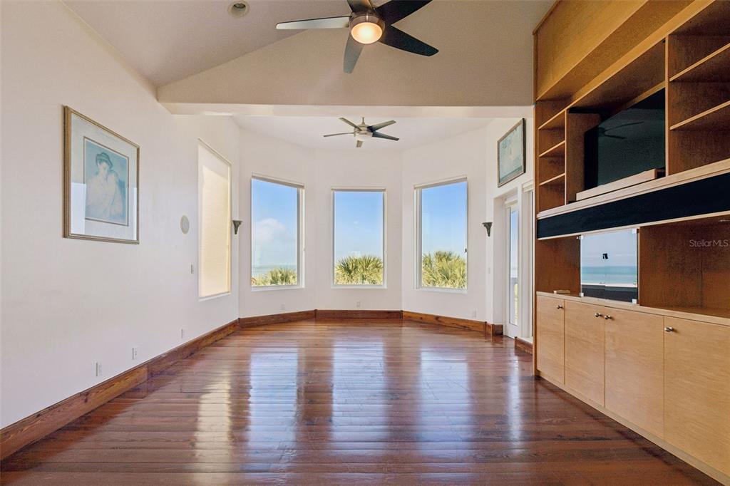 2811 Sunset Way St. Pete Beach, FL 33706 - Photo 50 of 97 a view of an empty room with window and wooden floor