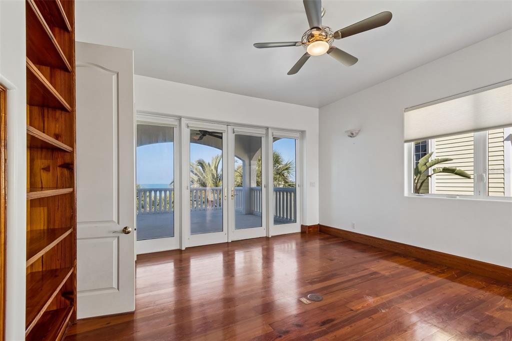 2811 Sunset Way St. Pete Beach, FL 33706 - Photo 63 of 97 wooden floor in an empty room with a window