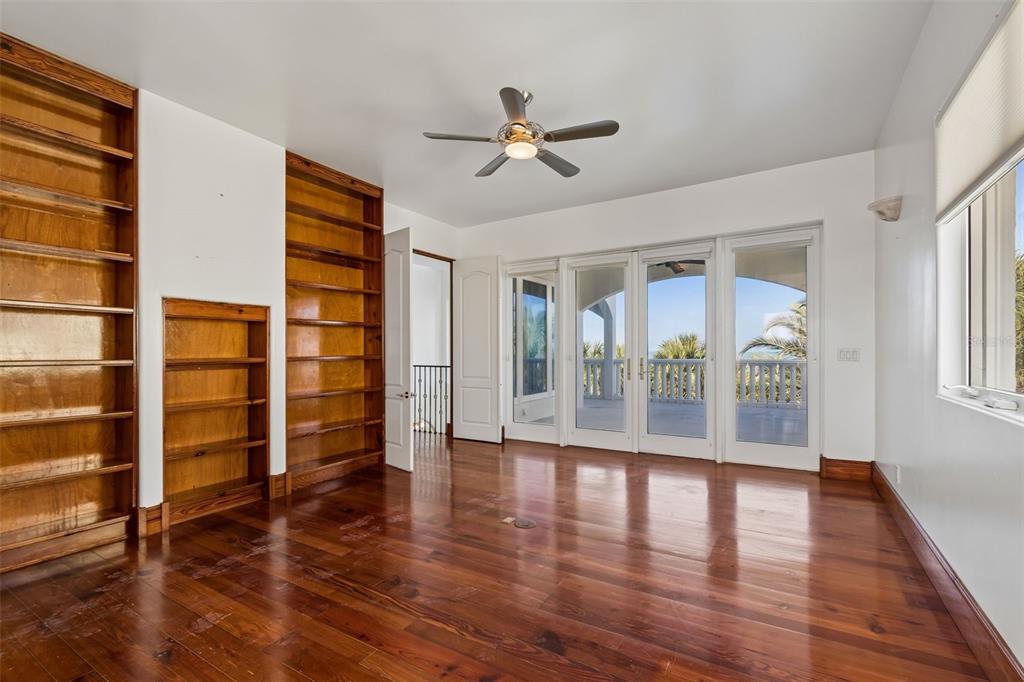2811 Sunset Way St. Pete Beach, FL 33706 - Photo 64 of 97 wooden floor in an empty room with a window