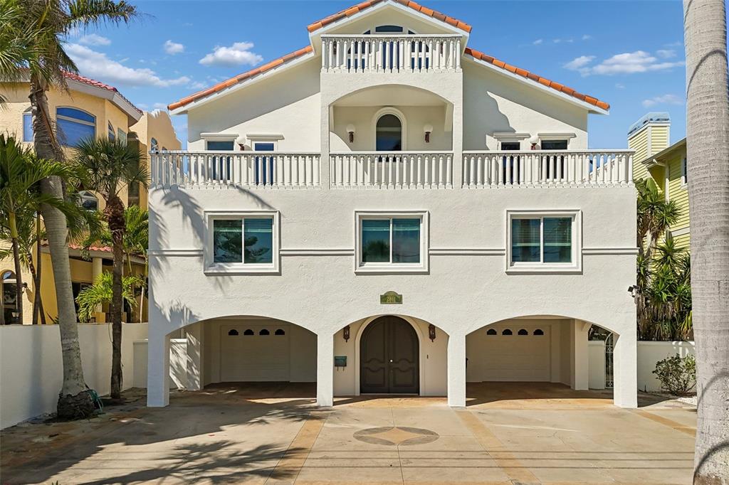 2811 Sunset Way St. Pete Beach, FL 33706 - Photo 95 of 97 a front view of a house with a yard