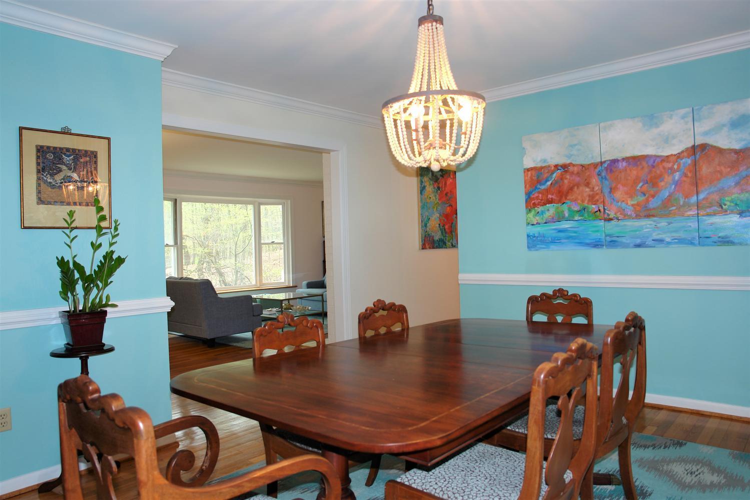 219 Darwin Road Southwest Roanoke, VA 24014 - Photo 12 of 58 a view of a dining room with furniture wooden floor and chandelier