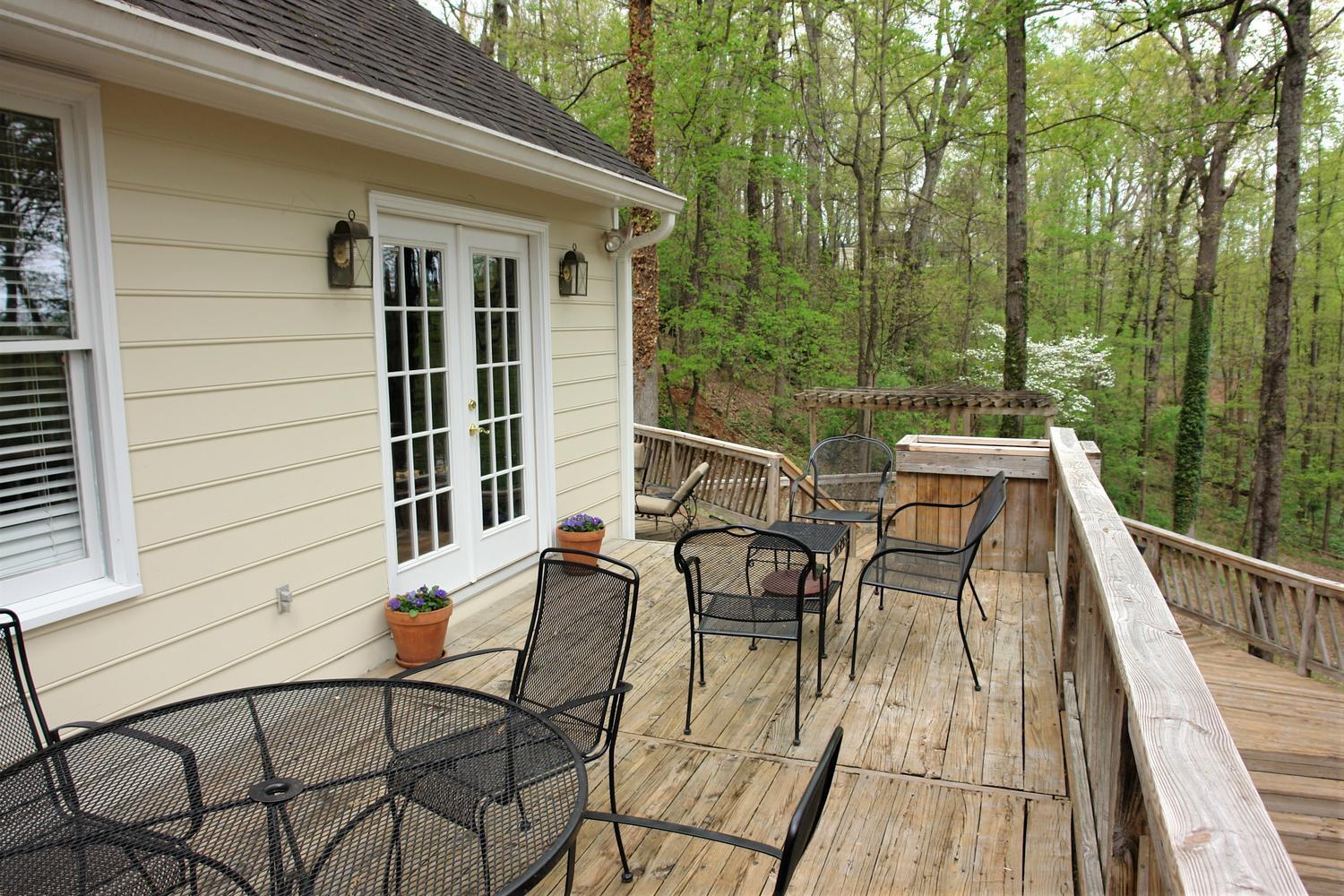 219 Darwin Road Southwest Roanoke, VA 24014 - Photo 21 of 58 a view of a patio with table and chairs with wooden floor and fence