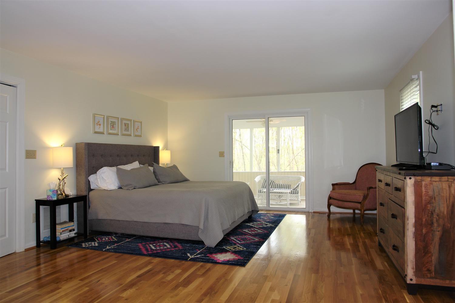 219 Darwin Road Southwest Roanoke, VA 24014 - Photo 24 of 58 a bedroom with a bed and wooden floor