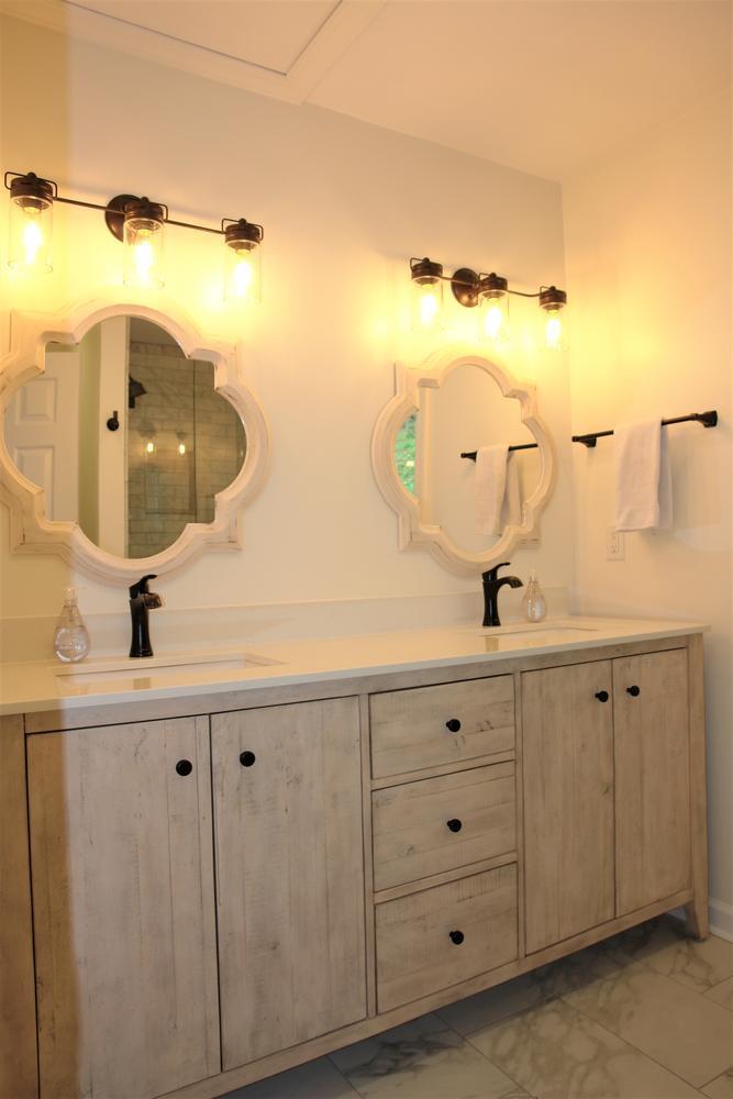 219 Darwin Road Southwest Roanoke, VA 24014 - Photo 29 of 58 a bathroom with a double vanity sink and mirror