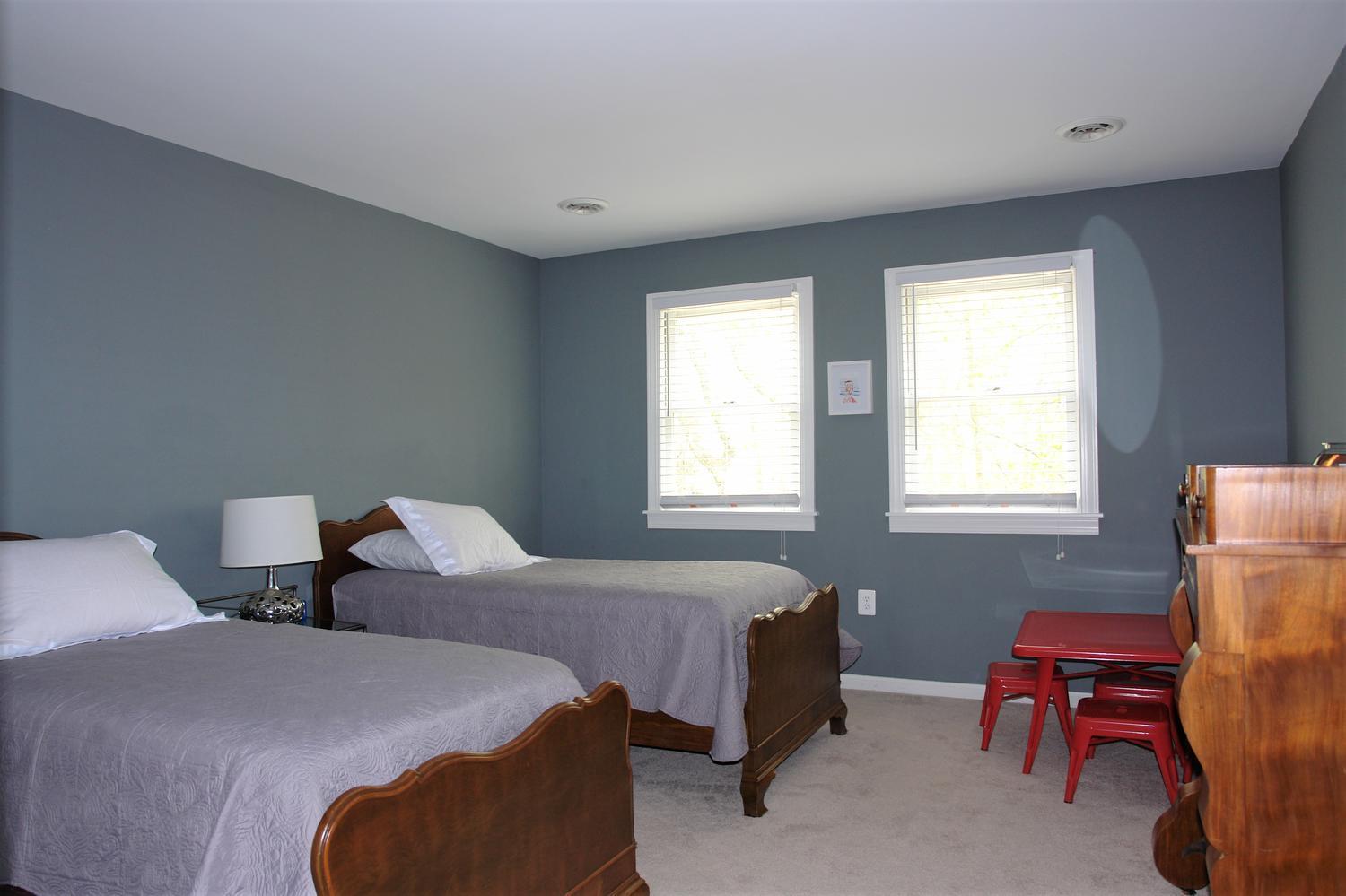 219 Darwin Road Southwest Roanoke, VA 24014 - Photo 34 of 58 a bedroom with two beds and a chair
