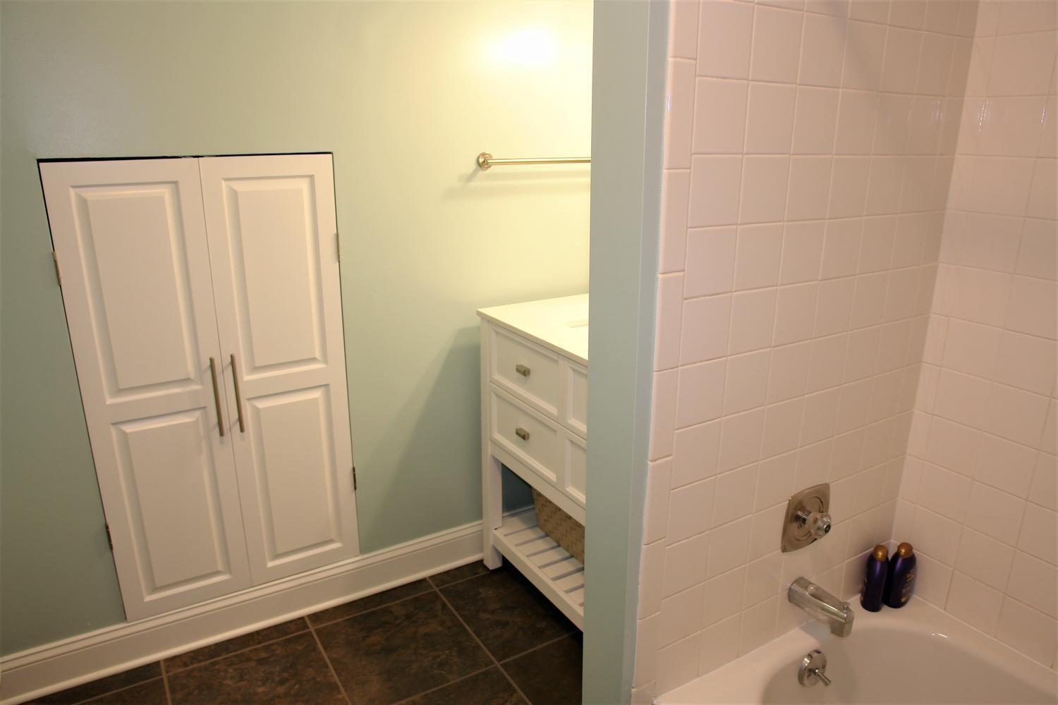 219 Darwin Road Southwest Roanoke, VA 24014 - Photo 38 of 58 a bathroom with a bathtub and a shower