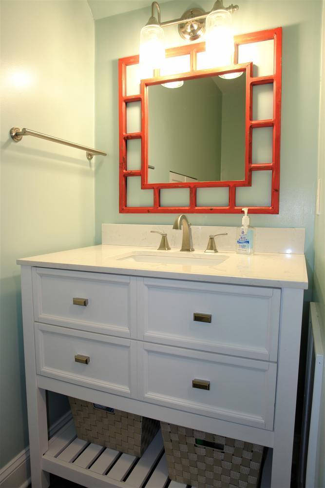 219 Darwin Road Southwest Roanoke, VA 24014 - Photo 39 of 58 a bathroom with a sink and a mirror