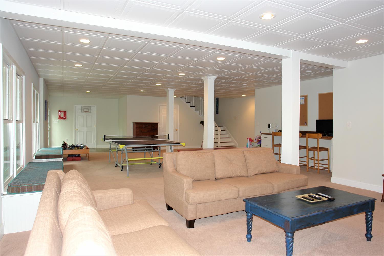 219 Darwin Road Southwest Roanoke, VA 24014 - Photo 41 of 58 a living room with furniture and a flat screen tv