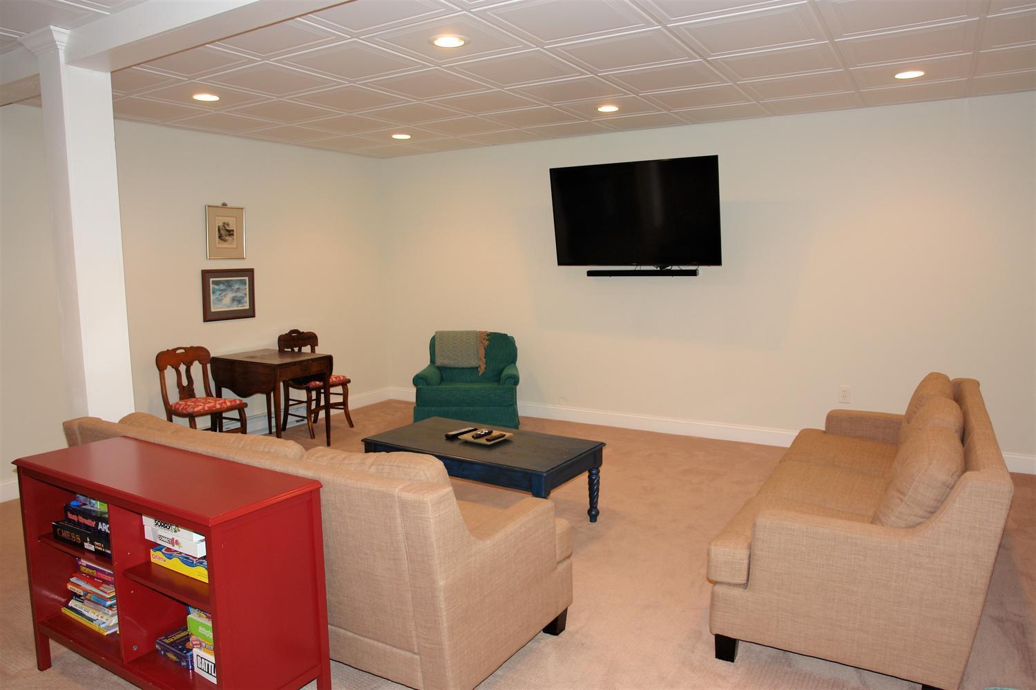 219 Darwin Road Southwest Roanoke, VA 24014 - Photo 42 of 58 a living room with furniture and a flat screen tv