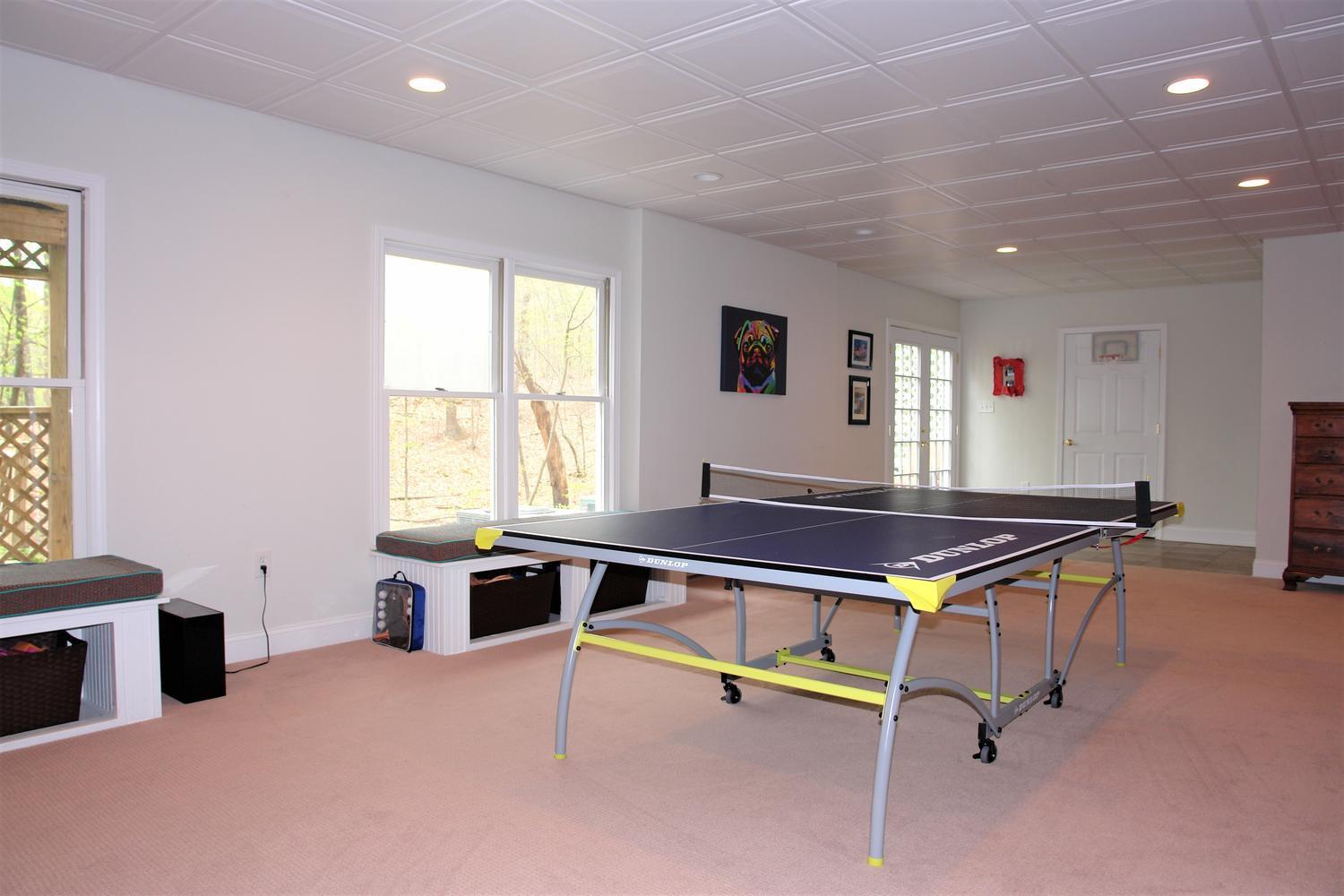 219 Darwin Road Southwest Roanoke, VA 24014 - Photo 43 of 58 a room with gym equipment and windows