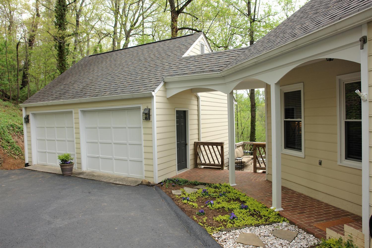 219 Darwin Road Southwest Roanoke, VA 24014 - Photo 46 of 58 a front view of a house with a outdoor seating