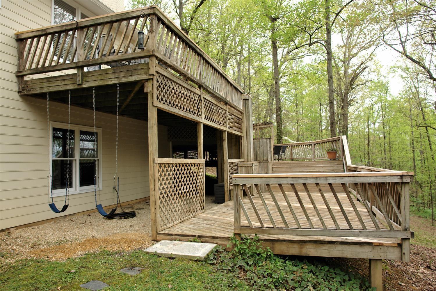 219 Darwin Road Southwest Roanoke, VA 24014 - Photo 54 of 58 a view of a house with a wooden deck and furniture