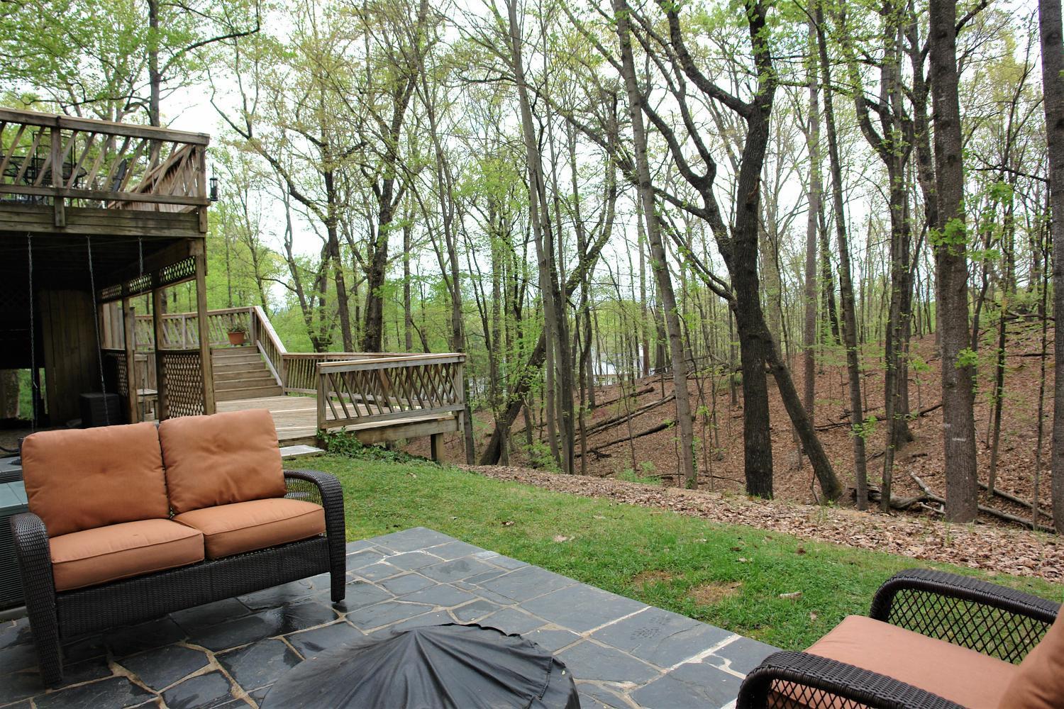 219 Darwin Road Southwest Roanoke, VA 24014 - Photo 56 of 58 a view of backyard with a table and chairs and a large tree