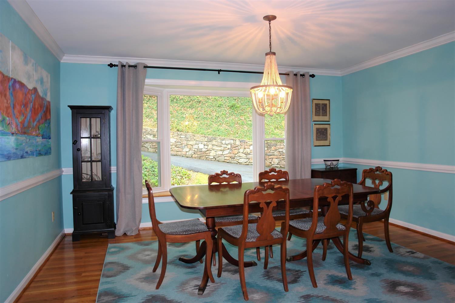 219 Darwin Road Southwest Roanoke, VA 24014 - Photo 10 of 58 a view of a dining room with furniture window and wooden floor