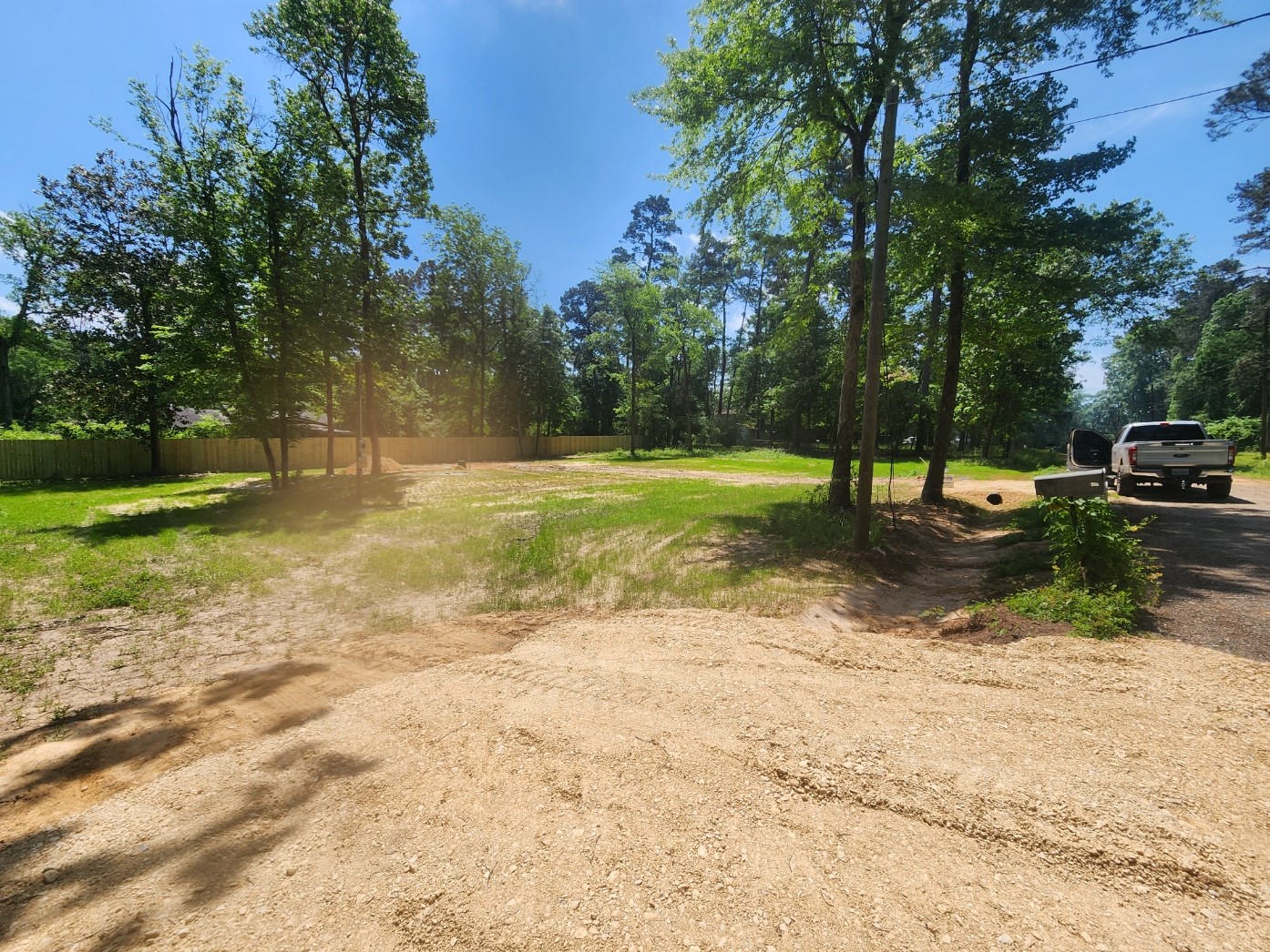 a view of a park with swings and trees